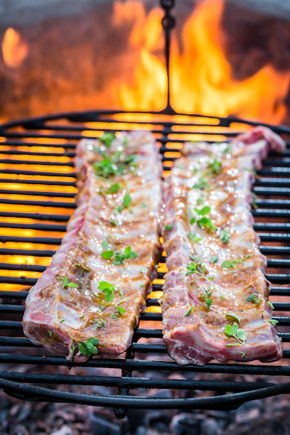 Hot ribs with thyme and spices on grill
